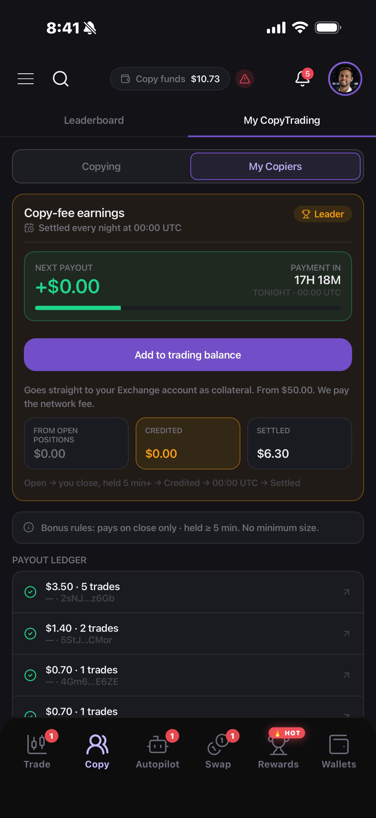 Copy-fee earnings on the app: next payout, settled every night at 00:00 UTC, credited and settled amounts, payout ledger